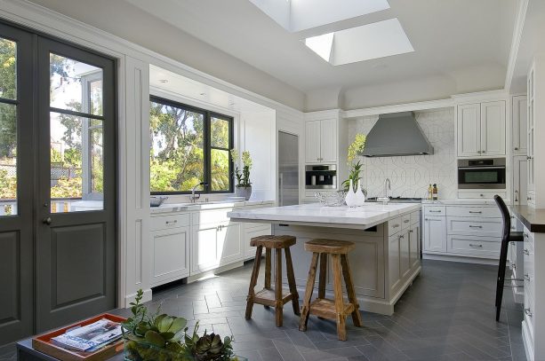 italian volcanic basalt floor tile in gray with white cabinets to create a transitional look