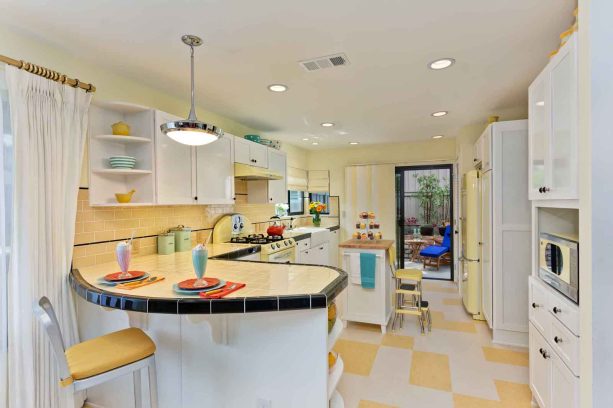 marmoleum click linoleum floor tile in a checkerboard pattern to create a retro look with white cabinets