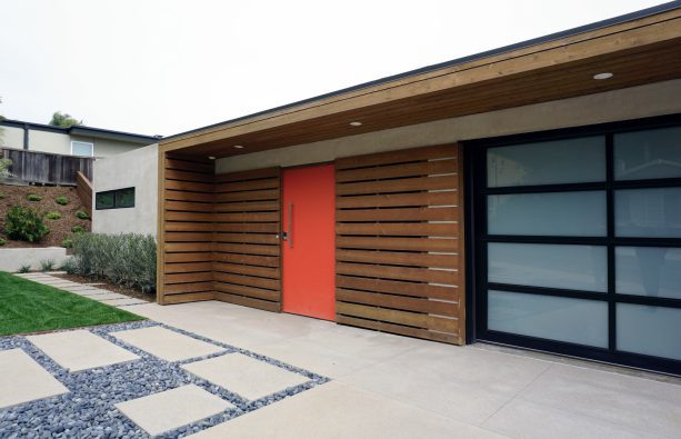 painting the door in a bright color to liven up the concrete front porch