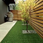 the idea of contemporary landscaping with polished corner fences is made of meranti wood