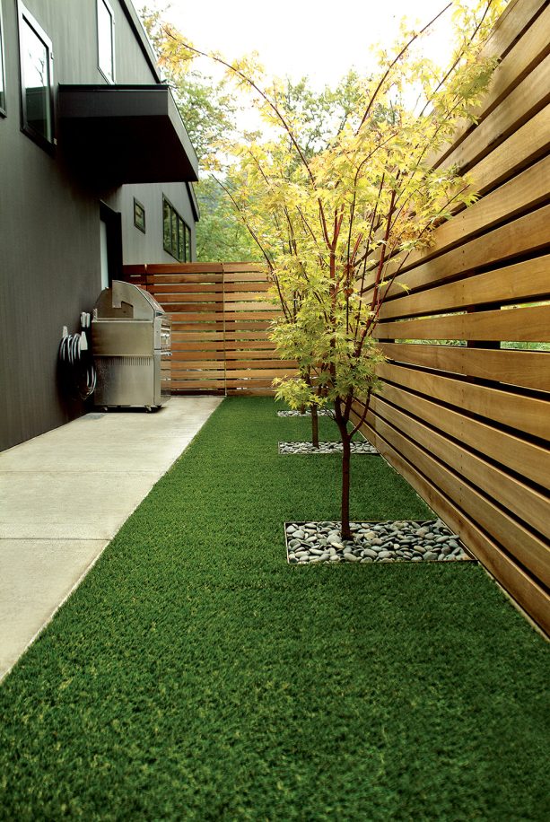 the idea of contemporary landscaping with polished corner fences is made of meranti wood