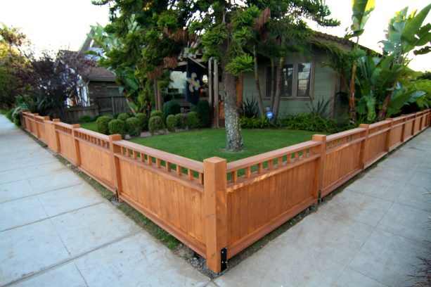 the idea of craftsman-style wood corner fence bordering the landscape