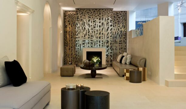 3d gold wallpaper around the fireplace as an accent wall