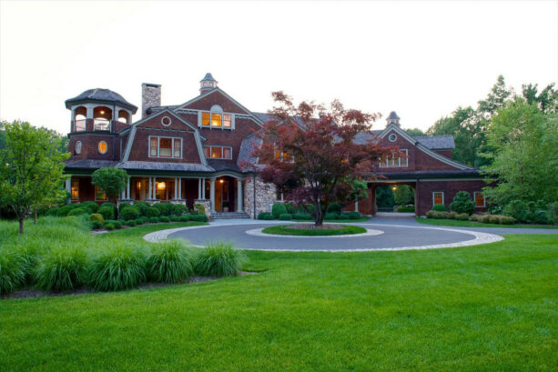 a majestic tree as the focal point in a circular driveway landscaping