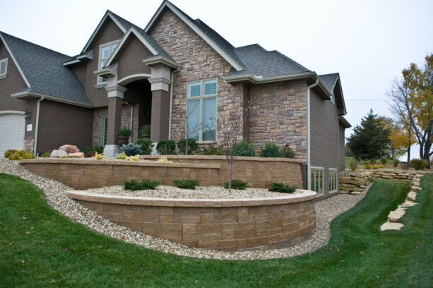 a tiered retaining wall made of a 3-piece mosaic block