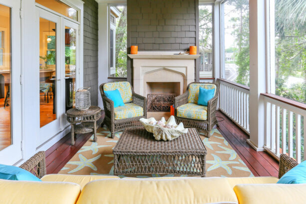 beach style front porch with rattan seating and colorful fabrics