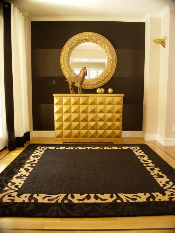 black painted wall with gold decorations as an accent