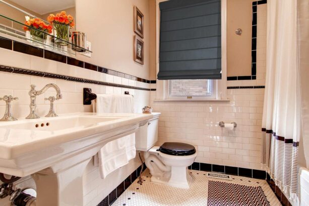 black subway tile bathroom trim combined with white tile and beige wall