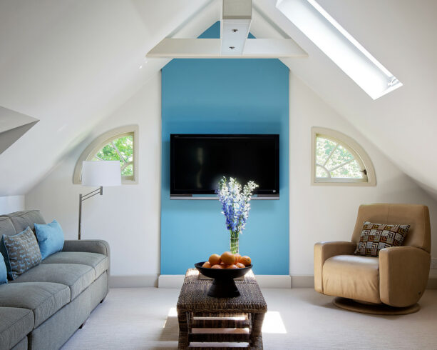 blue painted tv accent wall against the surrounding white wall