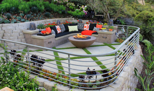 brightly colored raised patio with colorful perennials on the perimeter