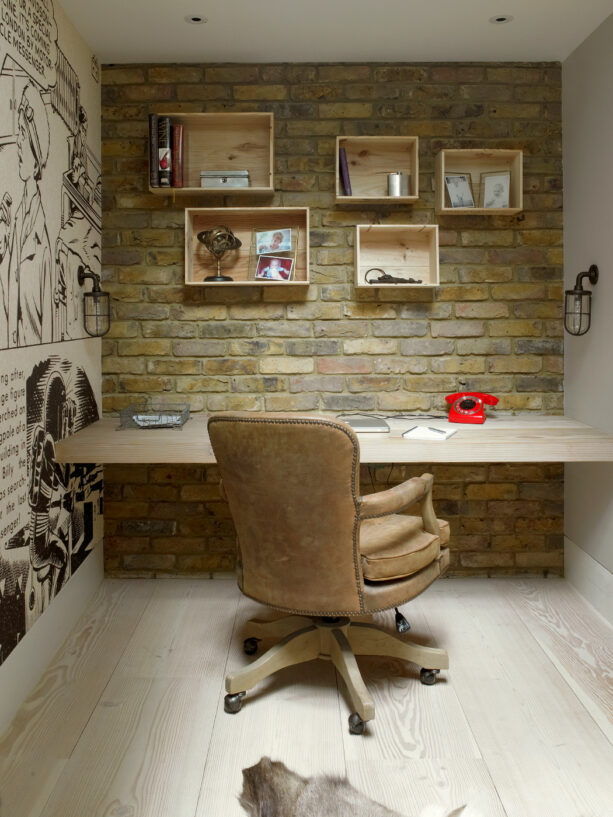 combination of bricks and wall covering as an accent in a small office