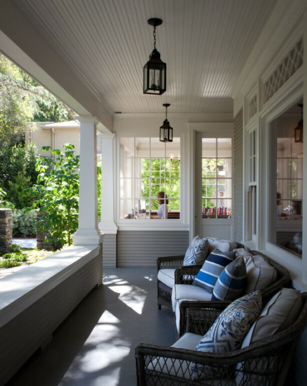 comfortable wicker furniture as a front porch seating with cushions and pillows