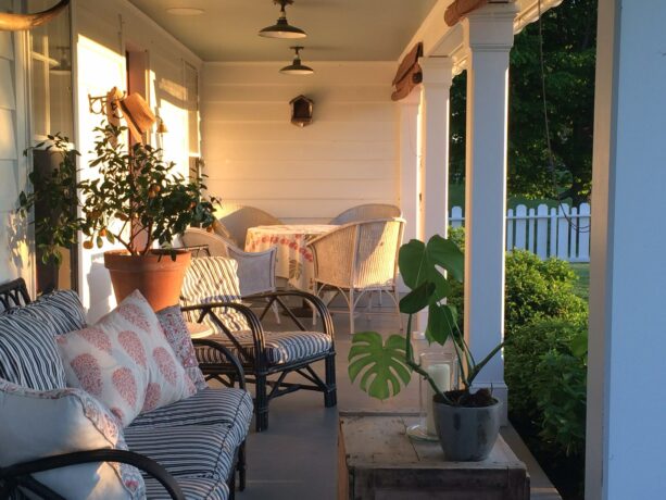 dark and light toned seating on a farmhouse front porch