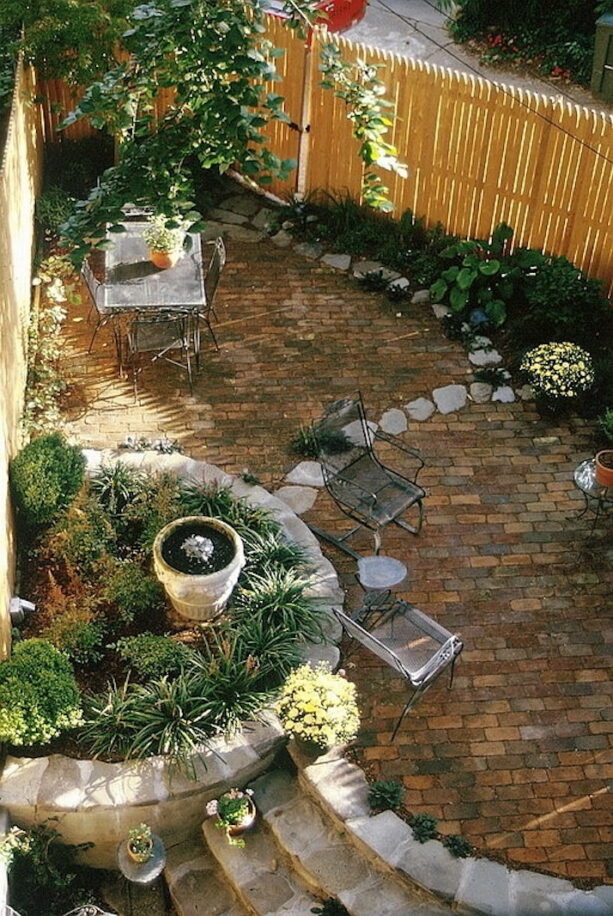 eclectic townhouse backyard in a triangular shape completed with a fountain