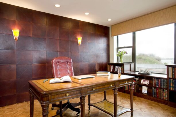 embossed leather tiles with sconces as an accent wall in a contemporary office