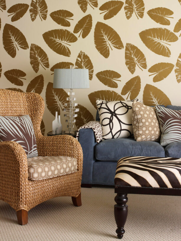 gold leaves wallpaper as an accent wall in a living room