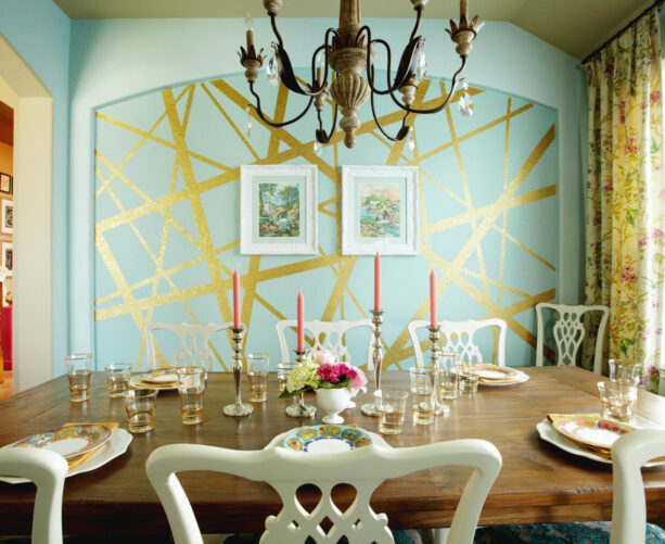 gold striped in a blue accent wall to create an eclectic look