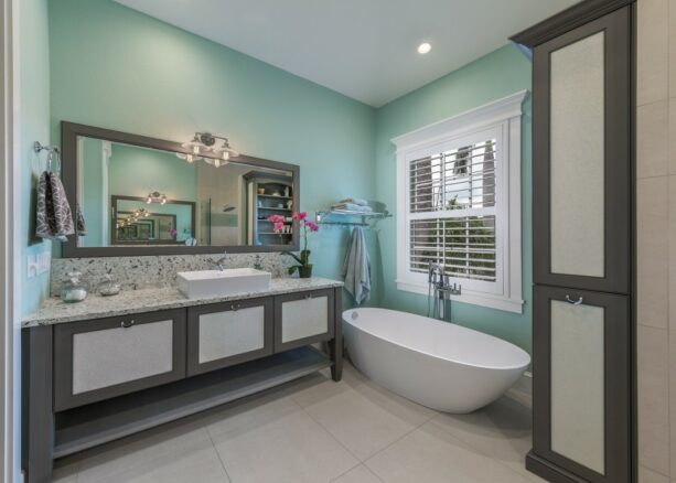 gray mirror and cabinet bathroom trim combined with white window trim
