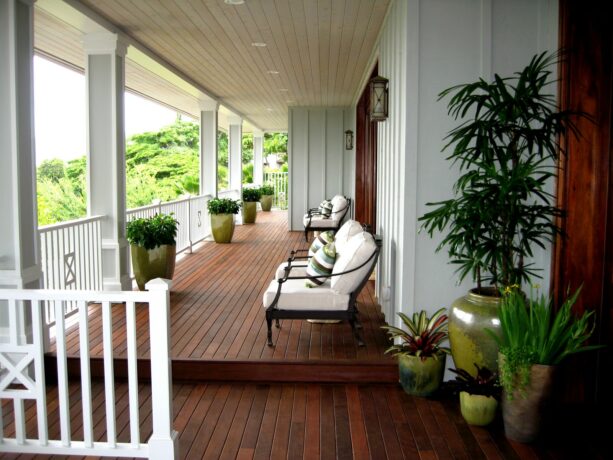 love seat from restoration hardware as seating in a tropical front porch