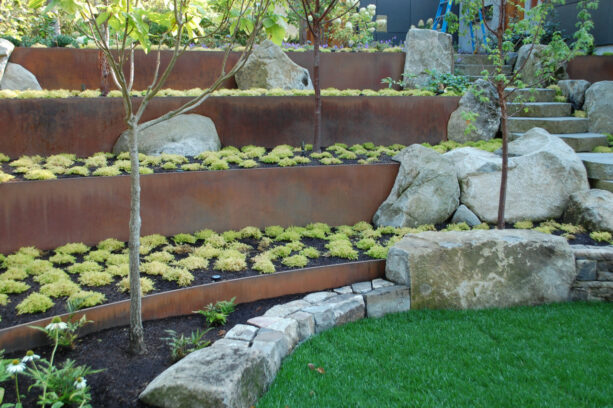 oregon mild steel tiered retaining wall paired with boulders