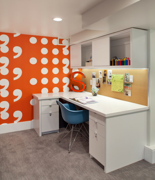 “pause” wall covering in orange and white to create a bright office accent wall