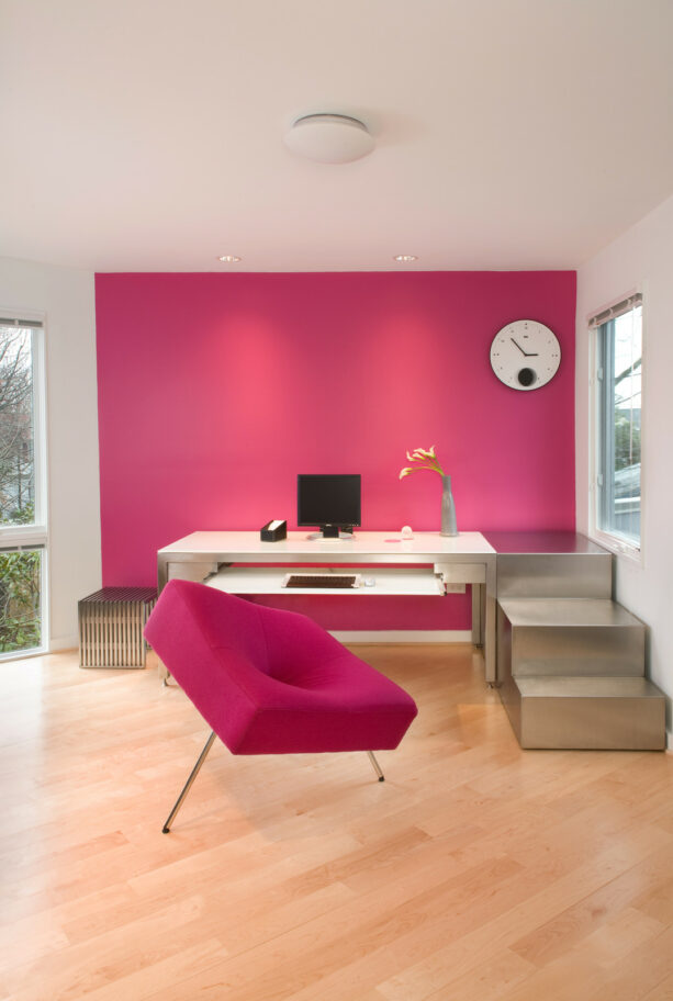 pink painted an accent wall in a modern home office