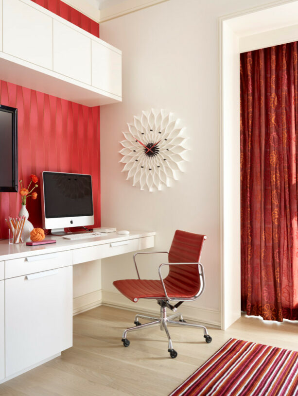 red wallpaper as an office accent wall that matches the chair