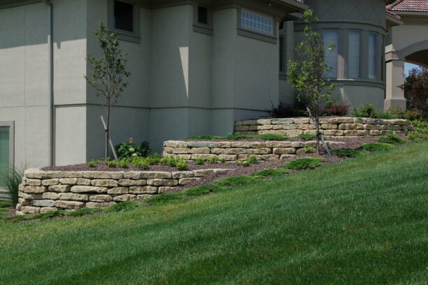 small tiered retaining wall made of limestone for a traditional look