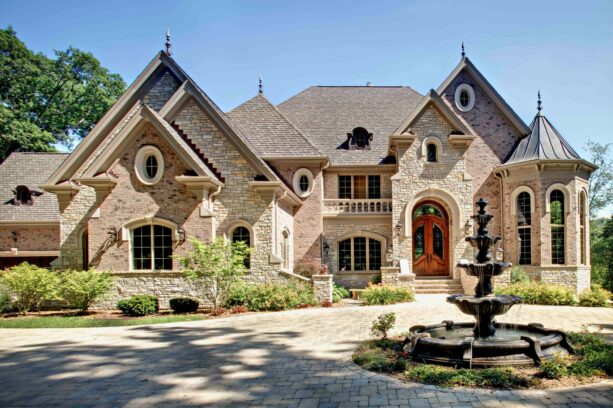 three-tier renaissance fountain landscaping in a brick circular driveway