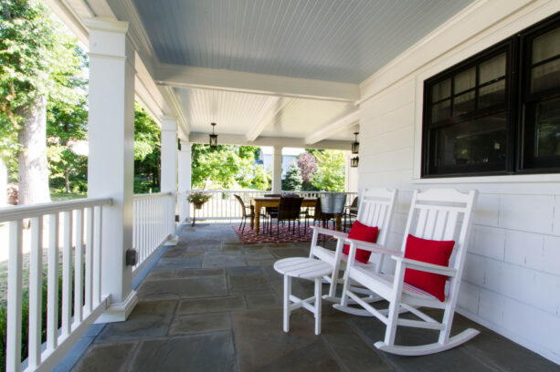 two rocking chairs and a set of the dining table as front porch seating