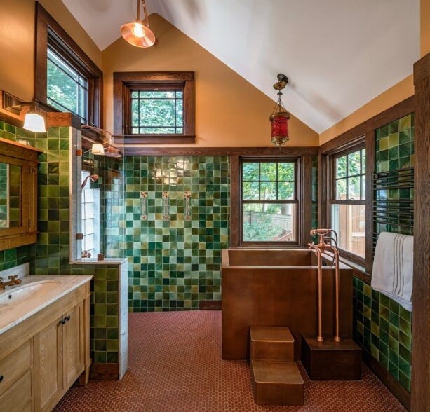 wood bathroom tile accentuates the green tile and brown walls