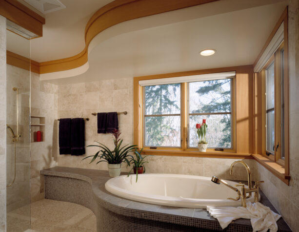 yellow gold bathroom trims to accentuate the beige walls