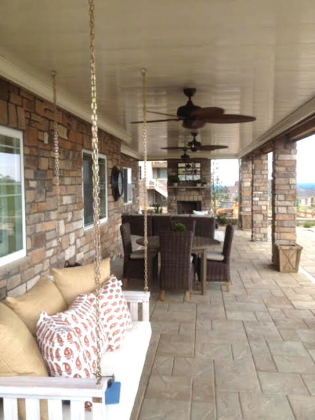 classic under deck patio idea with a swing