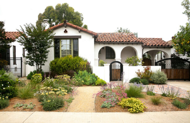 enclosed mediterranean front yard with 4-foot tall stucco wall to give privacy