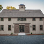farmhouse exterior with pine vertical shiplap siding in a smooth finish