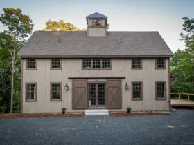farmhouse exterior with pine vertical shiplap siding in a smooth finish