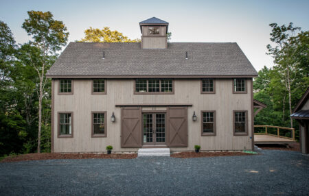 farmhouse exterior with pine vertical shiplap siding in a smooth finish