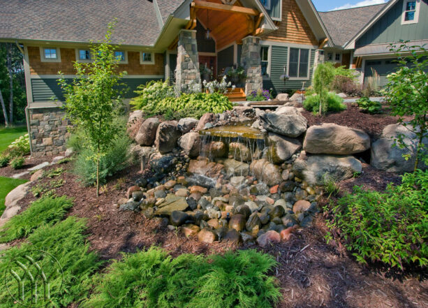 incorporating a water feature in low-maintenance hillside landscaping