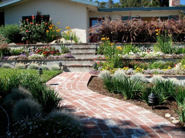 low-maintenance brick formal garden with terraces in hillside landscaping