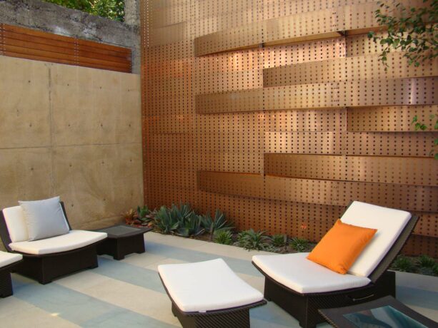 perforated copper mounted on a steel structure as a patio wall