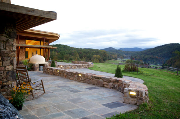 stone wall patio border to deliver a rustic look