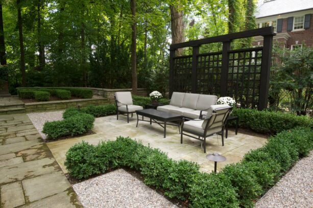 the idea of using plants as a patio border to add more greeneries