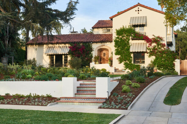 tuscan low-maintenance hillside landscaping with sloped garden