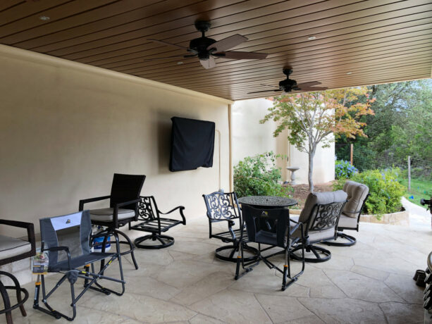 under deck patio utilized as an outdoor entertainment space