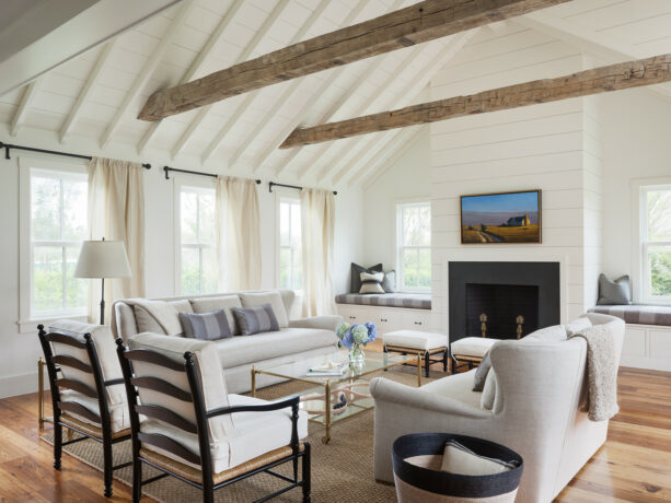 white and cross exposed beams in a vaulted ceiling