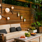 wood panel patio wall with decorative lights