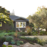 a single retaining wall made of corrugated metal with a cap