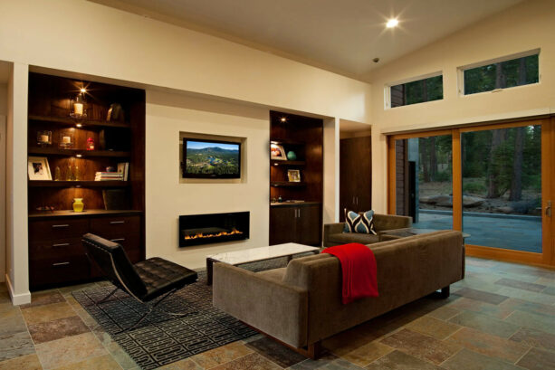 a stylish gas fireplace without a mantle with a recessed tv above it