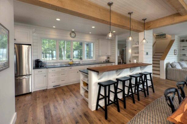beach style galley kitchen with a peninsula to create a breakfast bar
