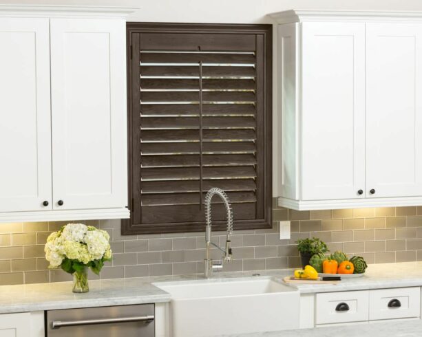 brown-painted kitchen window shutters to complement the backsplash